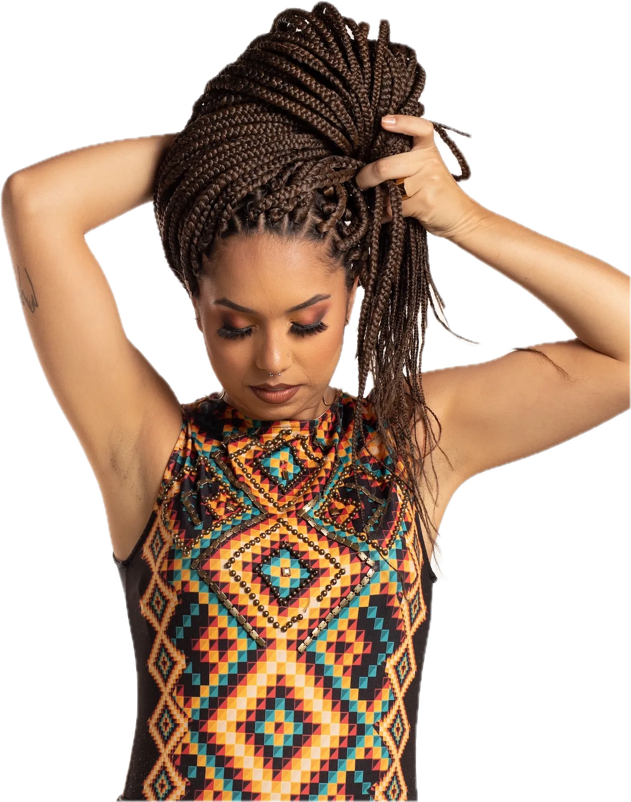 Model with long box braids gathered on top of her head