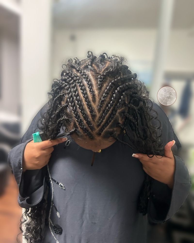 Fulani-style cornrows with long curly boho braids, seen from above