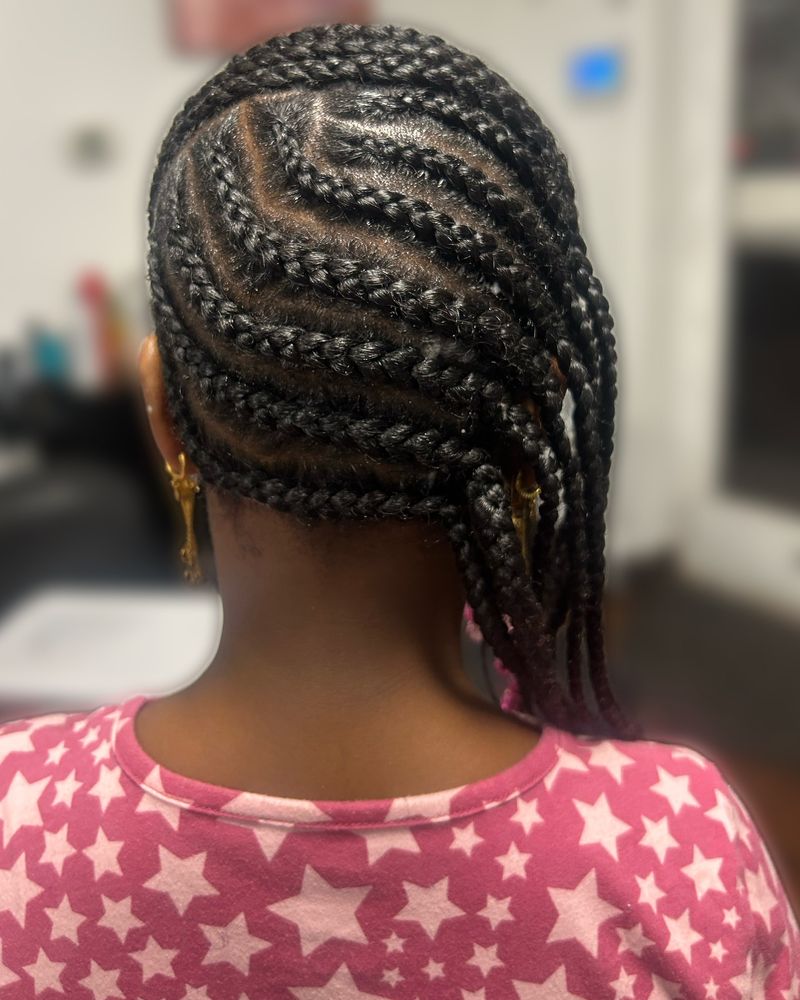 Child's side-swept curved cornrows flowing into braids