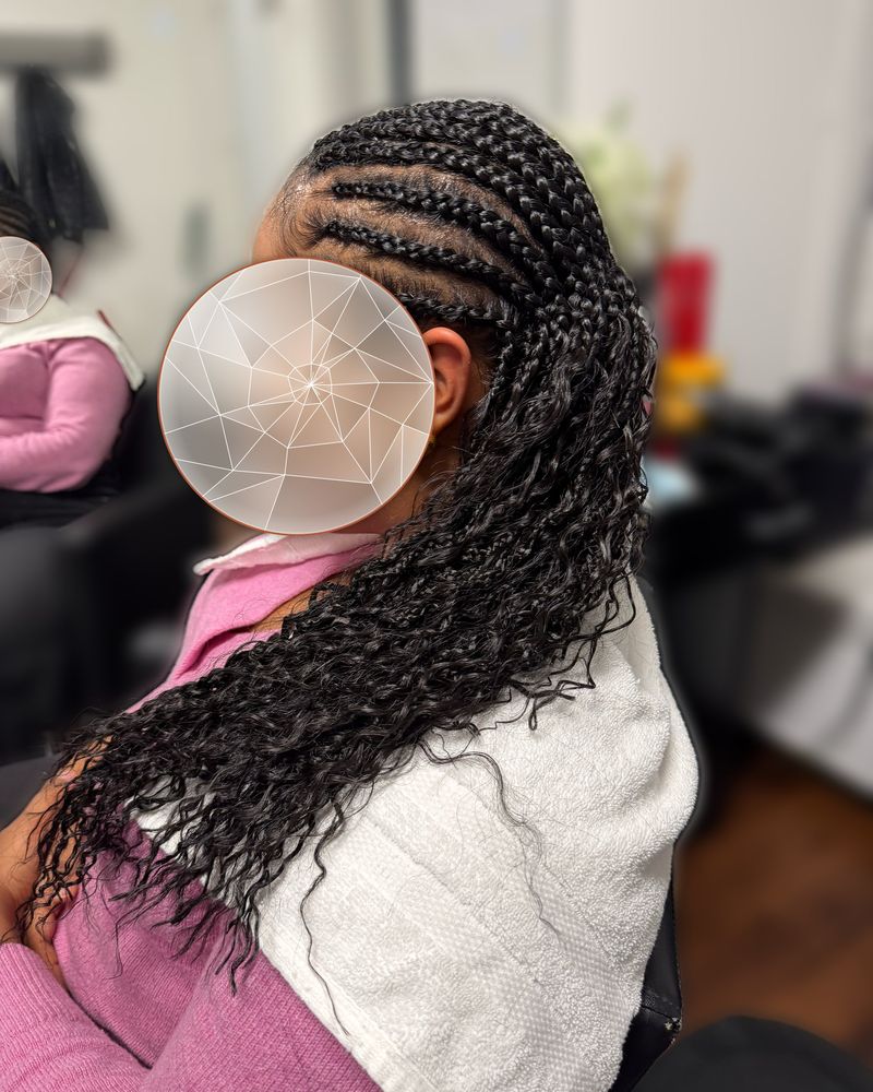 Side cornrows flowing into long curly boho braids