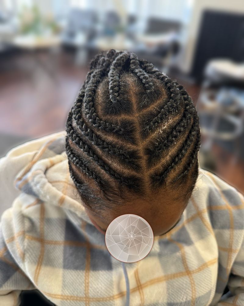 Cornrows in a V-shaped heart design, seen from above