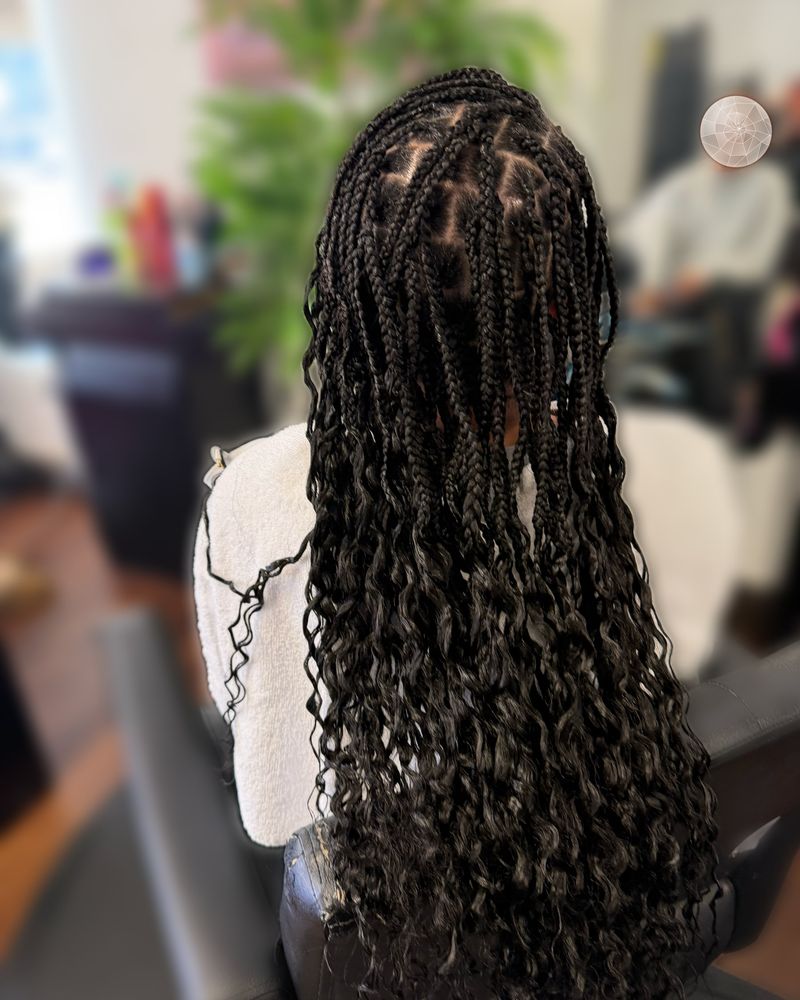 Boho knotless braids with curly ends, seen from behind