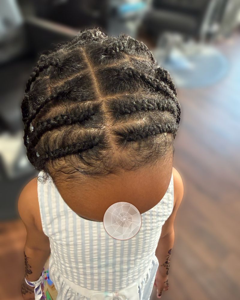 Child's criss-cross parted cornrows, seen from above