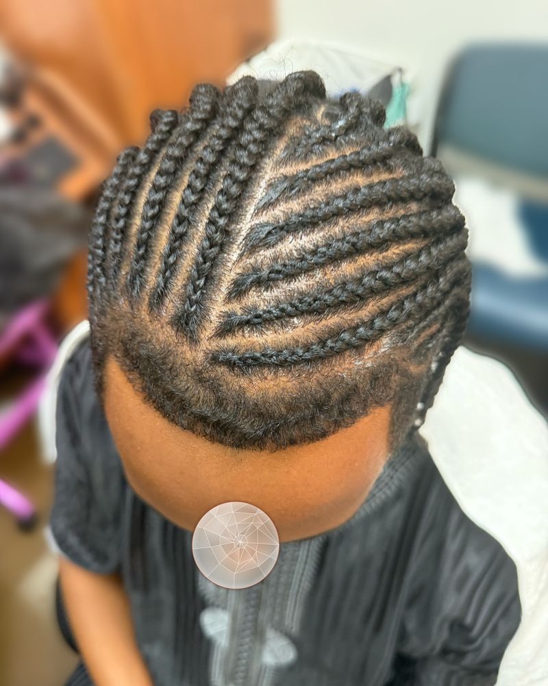 Child's side-swept curved cornrows, seen from above